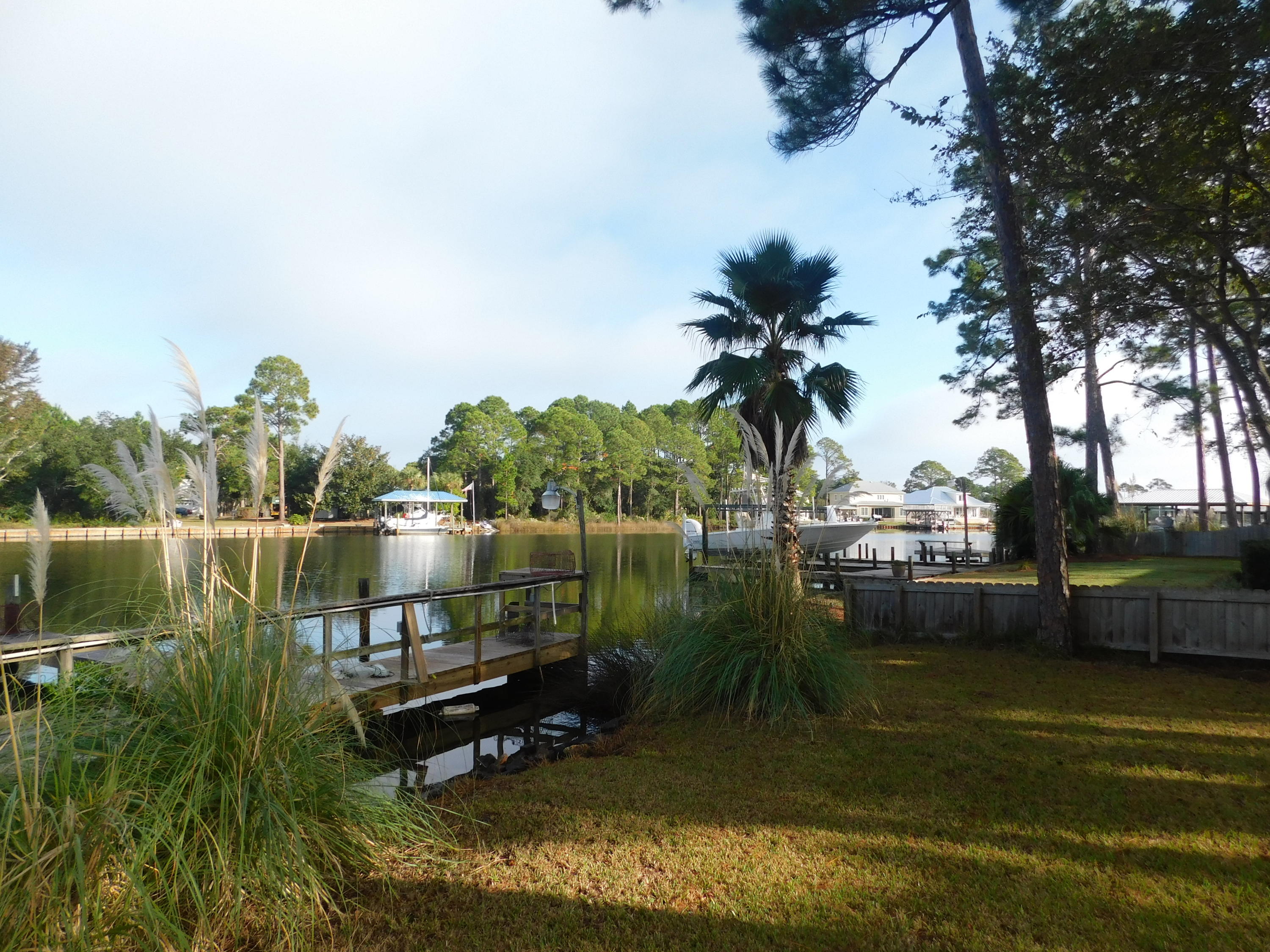 144 My Way, Unit A Santa Rosa Beach, FL 32459 - Photo 23 of 25 a view of a lake with a house