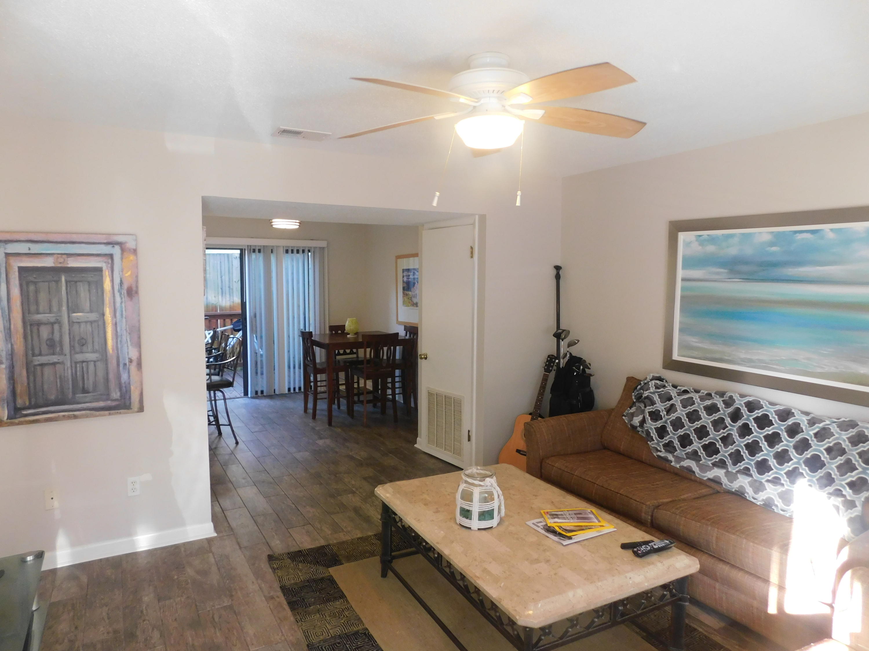 144 My Way, Unit A Santa Rosa Beach, FL 32459 - Photo 5 of 25 a living room with furniture and wooden floor