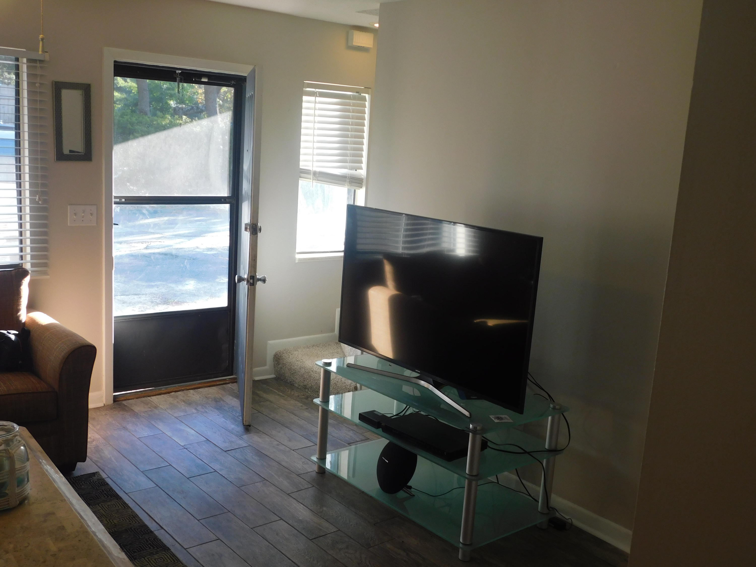 144 My Way, Unit A Santa Rosa Beach, FL 32459 - Photo 7 of 25 a room with wooden floor and windows