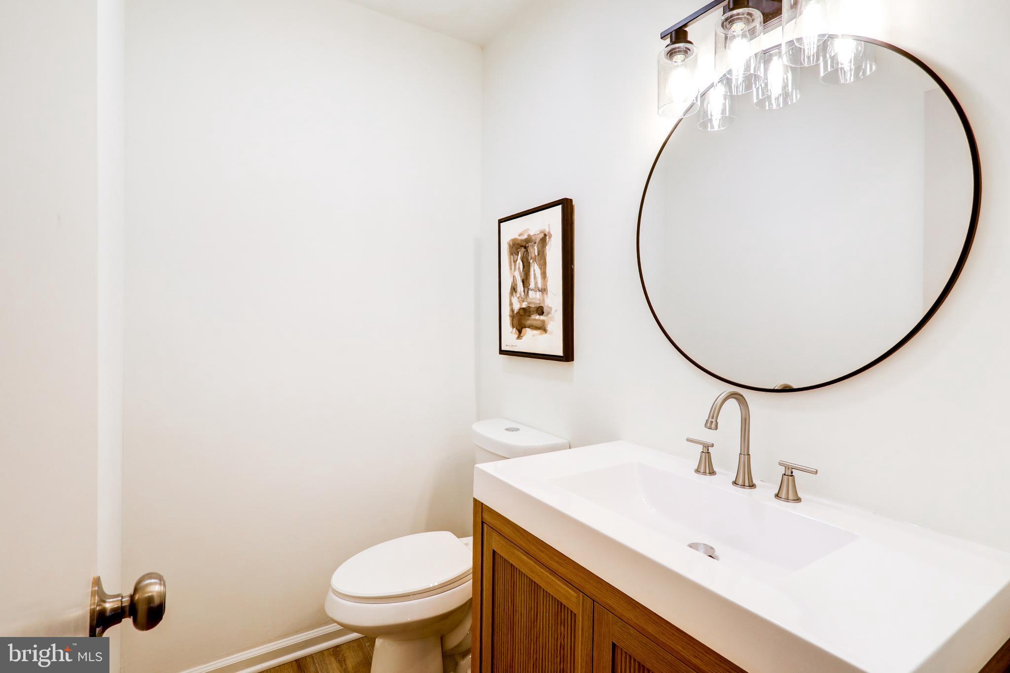2818 Nolt Road Lancaster, PA 17601 - Photo 16 of 37 a bathroom with a sink a mirror and a toilet