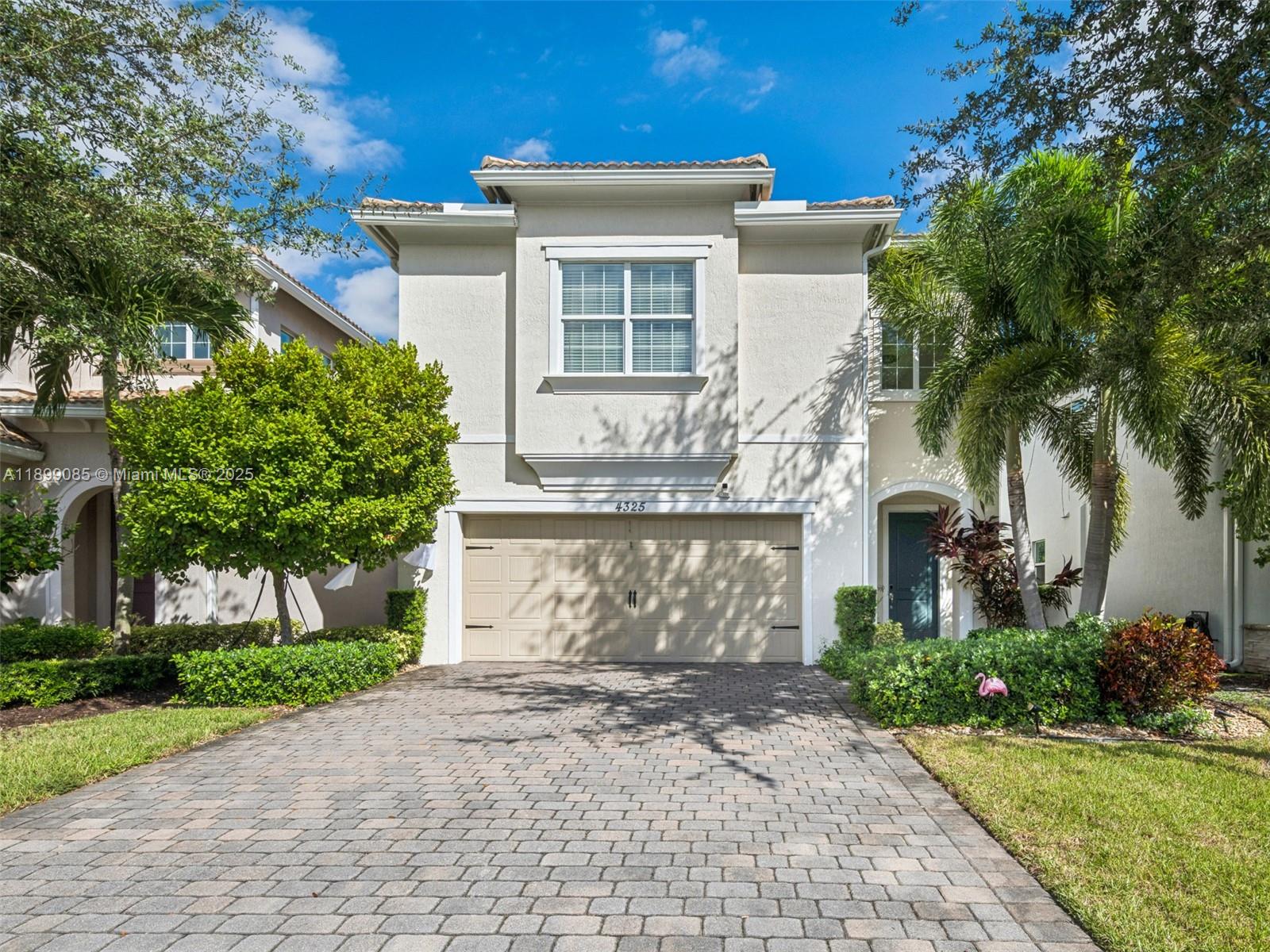 4325 Large Leaf Lane Hollywood, FL 33021 - Photo 1 of 72 a front view of a house with garden and garage