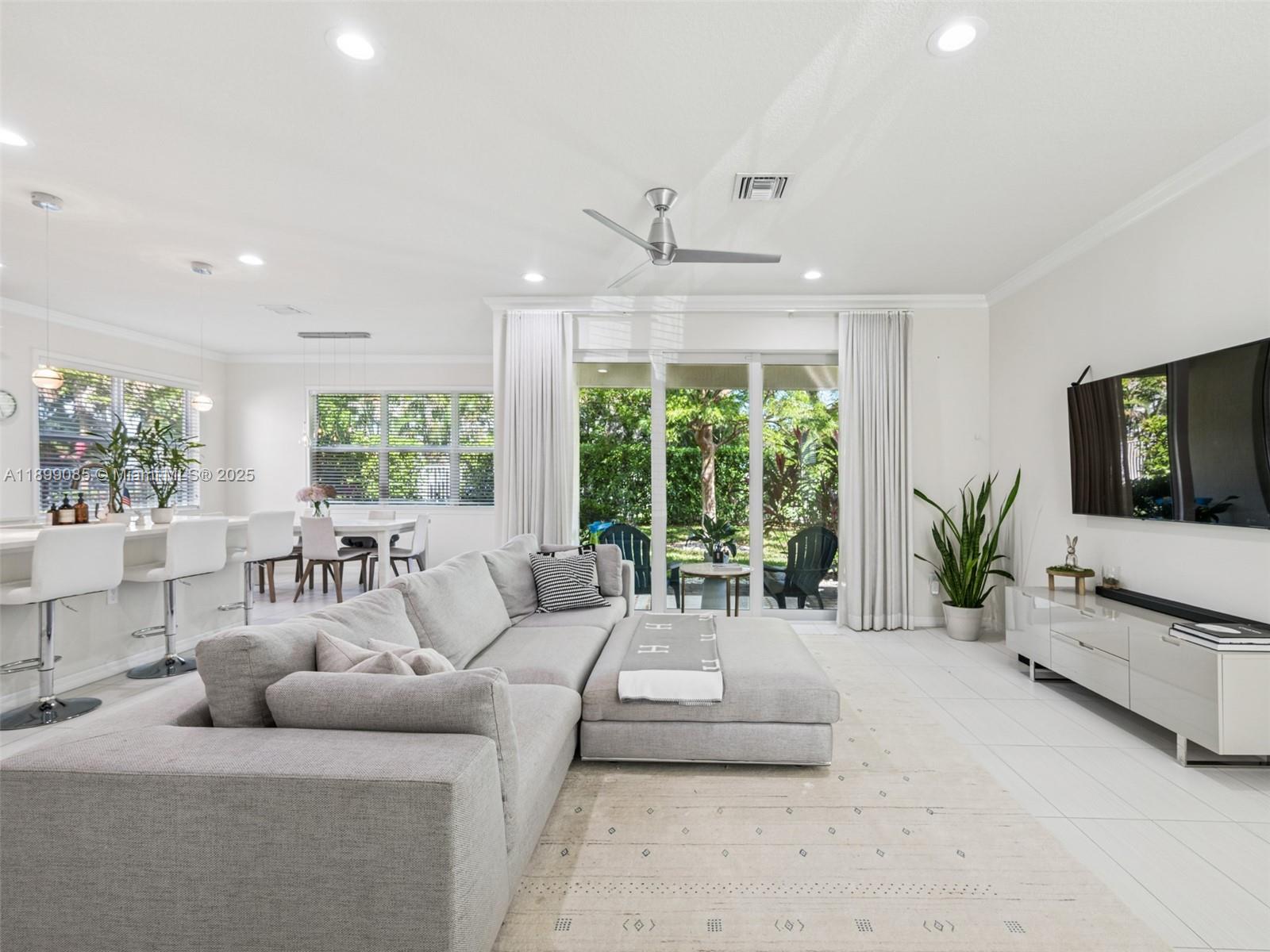 4325 Large Leaf Lane Hollywood, FL 33021 - Photo 12 of 72 a living room with furniture and a flat screen tv