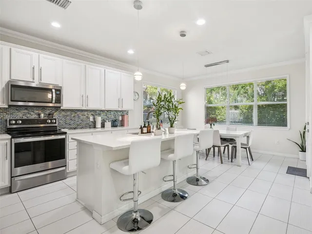 a view of a house with a yard and garage