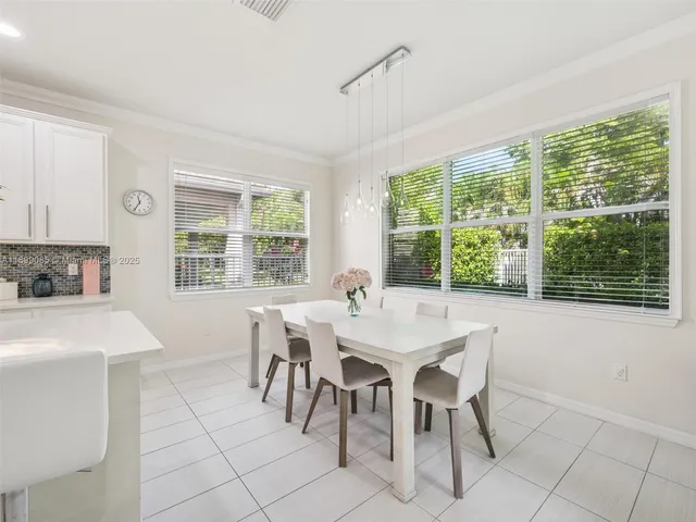 a bathroom with a sink toilet and a mirror