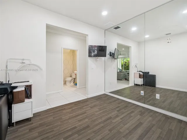 a view of a livingroom with workspace and a couch