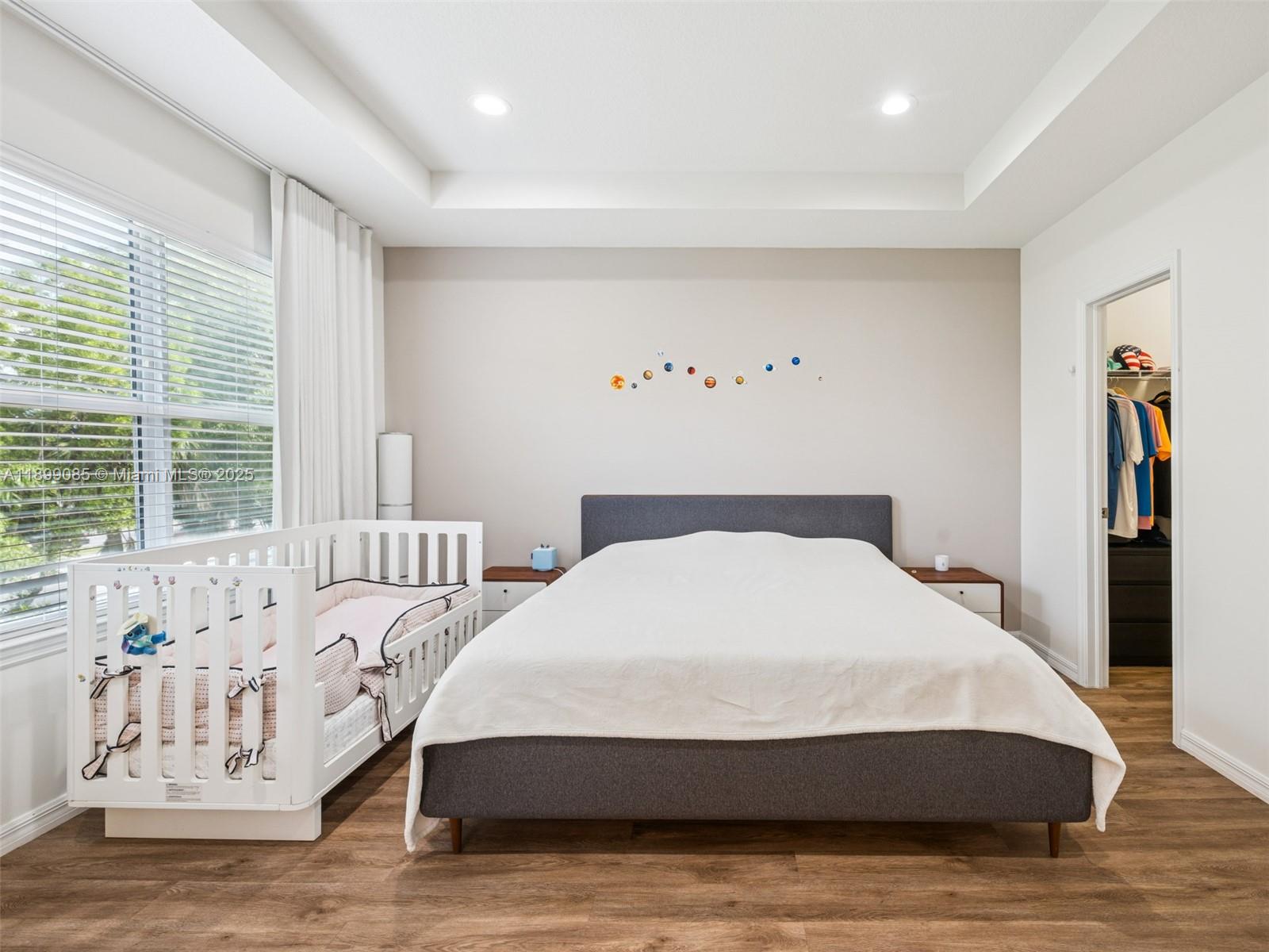 4325 Large Leaf Lane Hollywood, FL 33021 - Photo 27 of 72 a large bed sitting in a bedroom next to a window