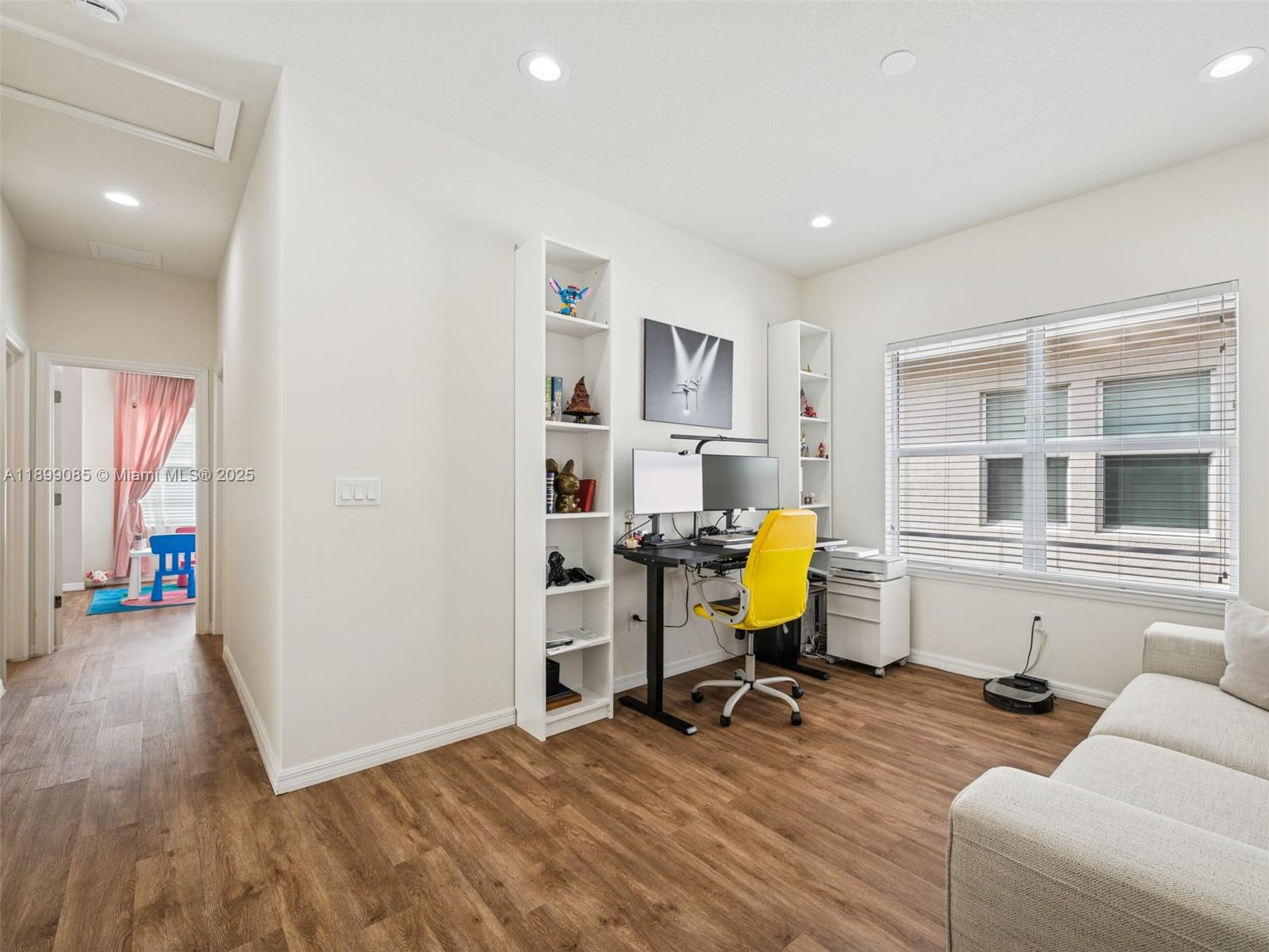 4325 Large Leaf Lane Hollywood, FL 33021 - Photo 30 of 72 a view of a livingroom with workspace and a couch