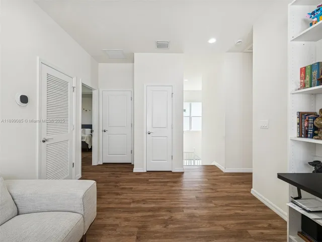 a living room with furniture fireplace and flat screen tv