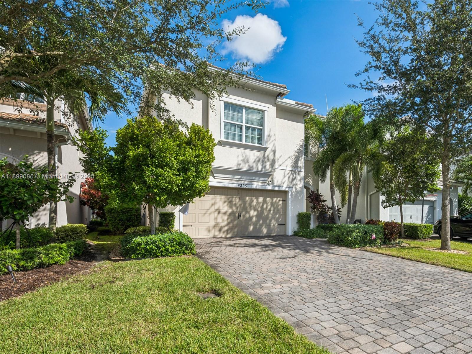 4325 Large Leaf Lane Hollywood, FL 33021 - Photo 6 of 72 a front view of a house with a yard and trees