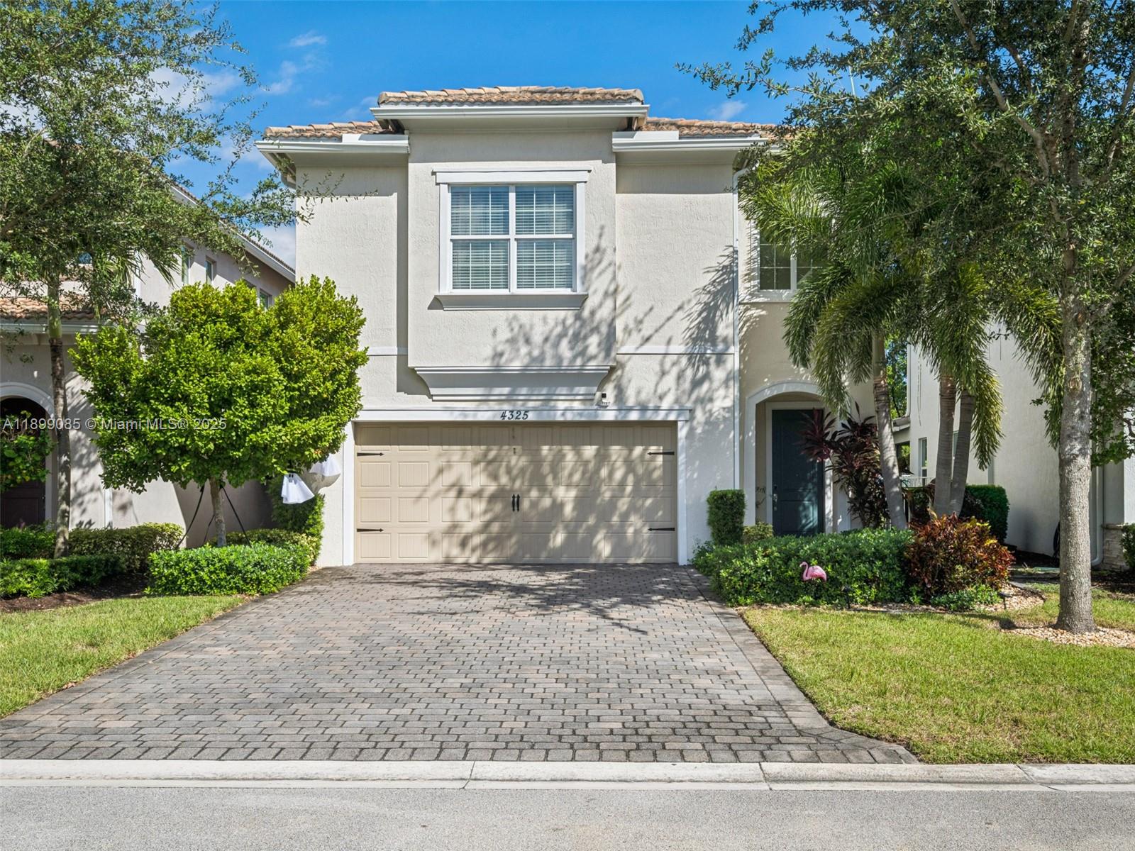 4325 Large Leaf Lane Hollywood, FL 33021 - Photo 7 of 72 a front view of a house with a garden