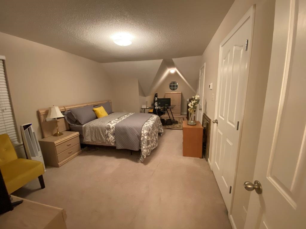 6806 Manslick Road Cordova, TN 38018 - Photo 21 of 21 a bedroom with a bed and a couch