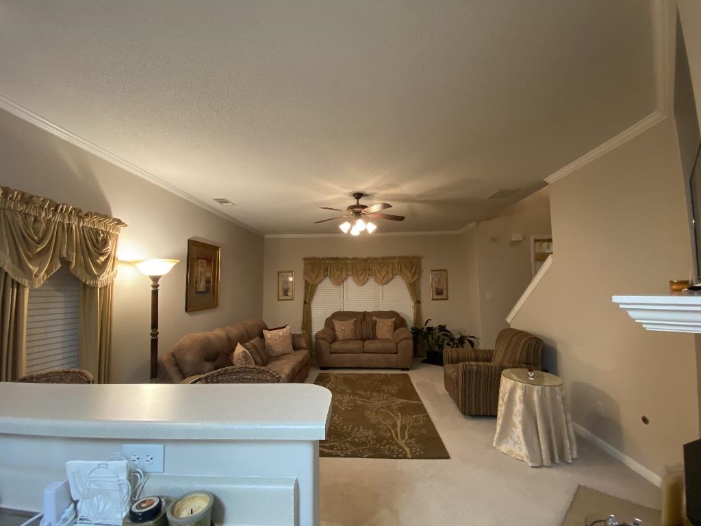 6806 Manslick Road Cordova, TN 38018 - Photo 9 of 21 a living room with furniture and a chandelier