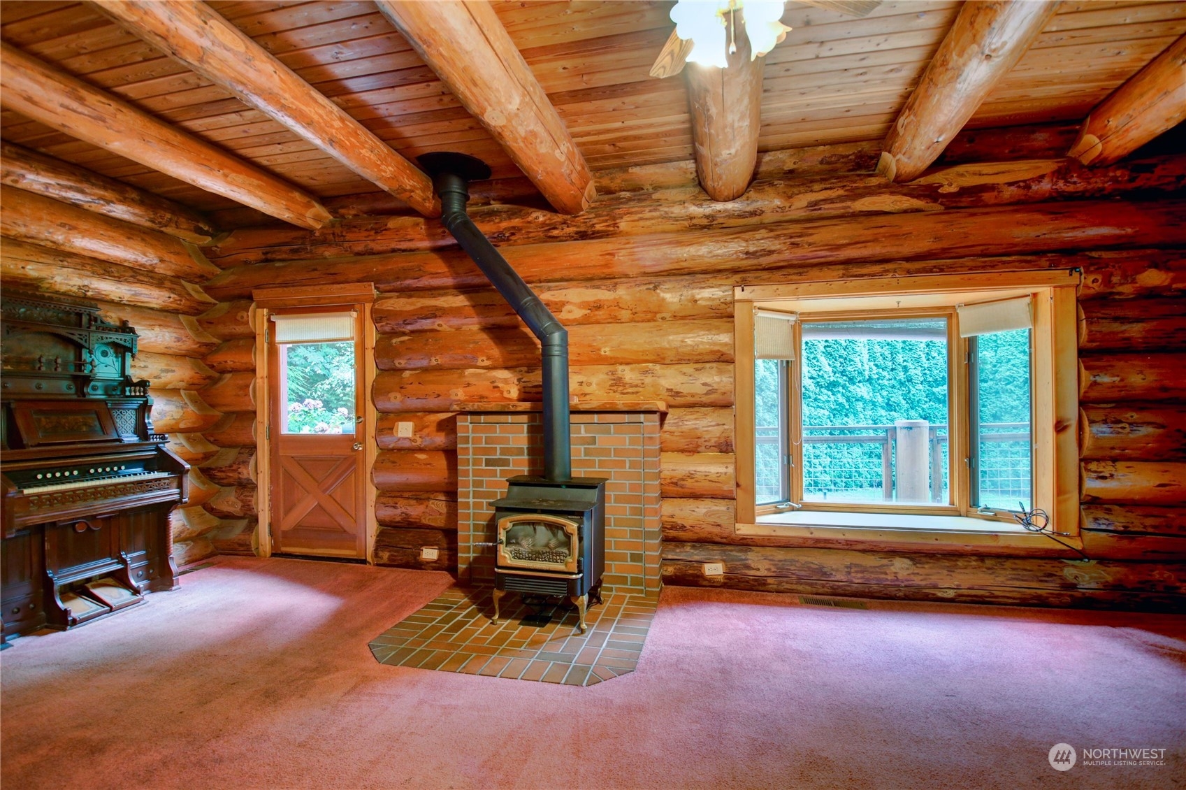 8920 Frost Road Sumas, WA 98295 - Photo 8 of 29 a view of a room with wooden floors and a fireplace
