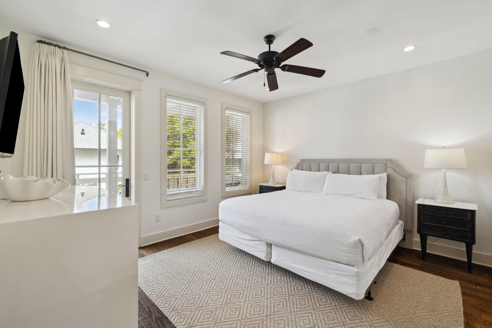 92 North Winston Lane Inlet Beach, FL 32461 - Photo 15 of 44 a bedroom with a bed a window and a chandelier