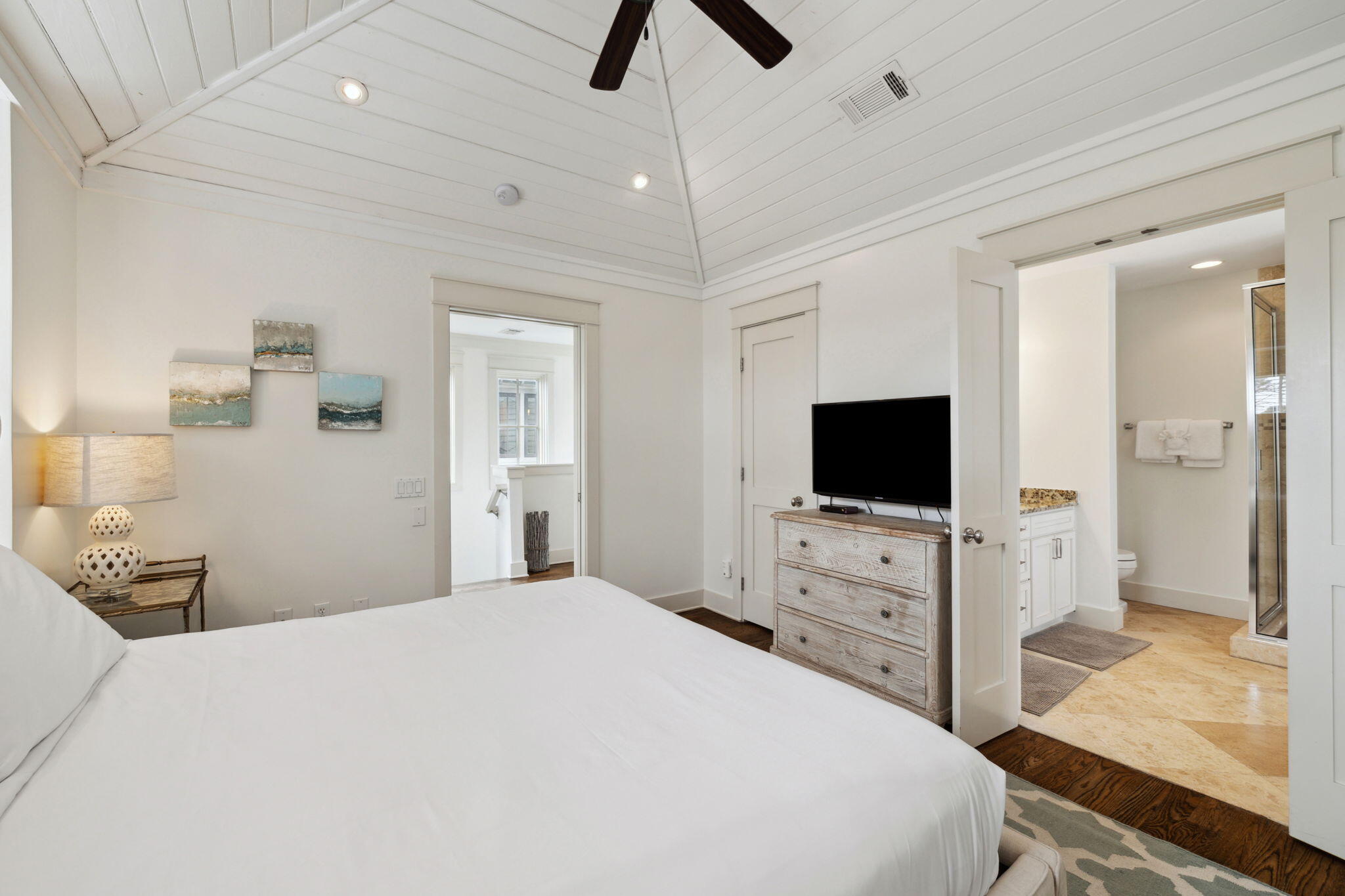 92 North Winston Lane Inlet Beach, FL 32461 - Photo 19 of 44 a bedroom with a bed and a flat tv screen on dresser