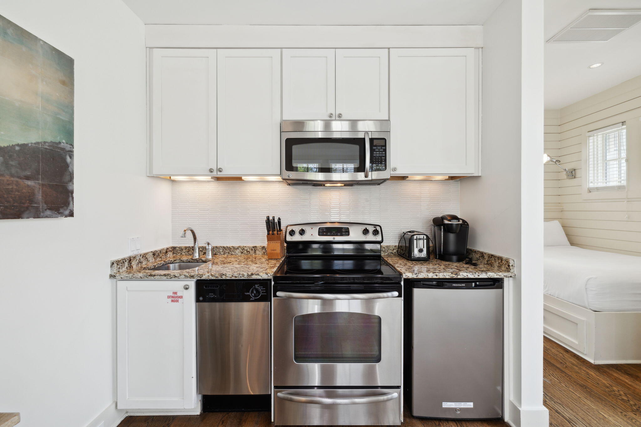92 North Winston Lane Inlet Beach, FL 32461 - Photo 30 of 44 a kitchen with stainless steel appliances granite countertop a stove a sink and a microwave