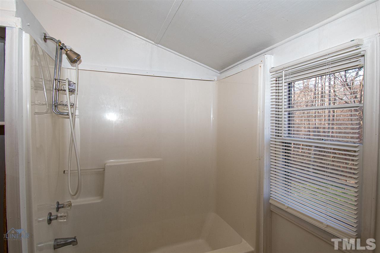 2243 Durham St Extension Burlington, NC 27217 - Photo 11 of 21 a bathroom with a shower
