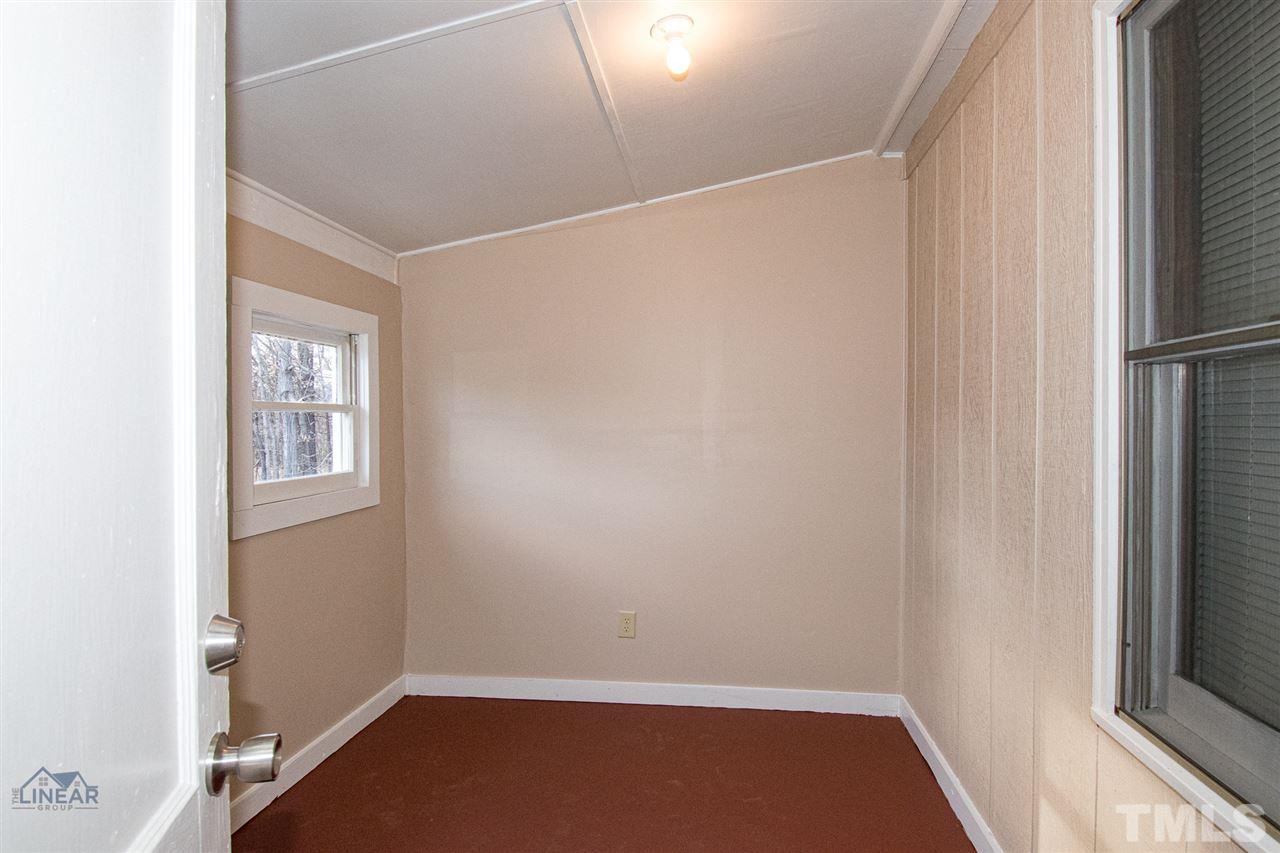 2243 Durham St Extension Burlington, NC 27217 - Photo 12 of 21 a view of small space with wooden floor and windows