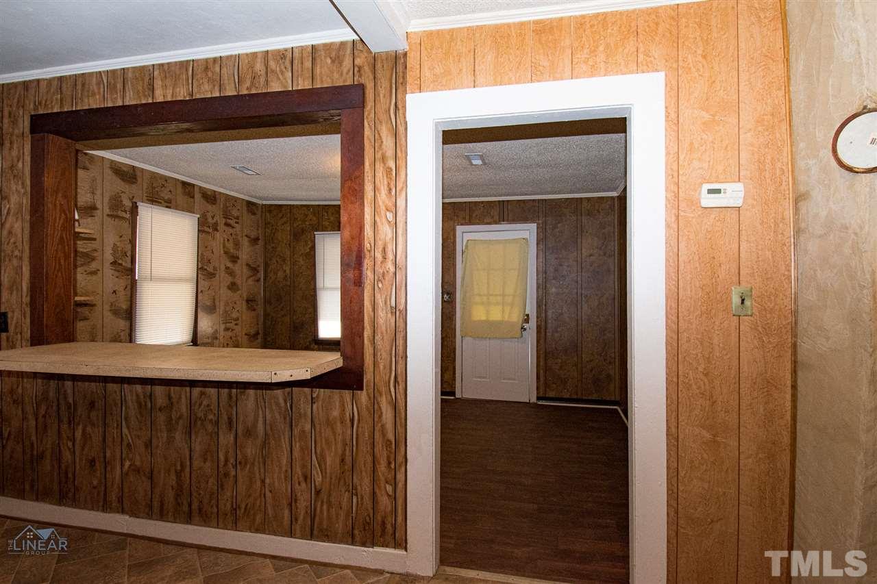 2243 Durham St Extension Burlington, NC 27217 - Photo 14 of 21 a view of a hallway with wooden floor