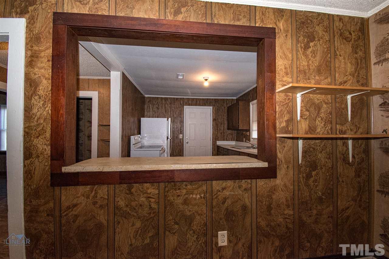 2243 Durham St Extension Burlington, NC 27217 - Photo 17 of 21 a bathroom with a sink and mirror