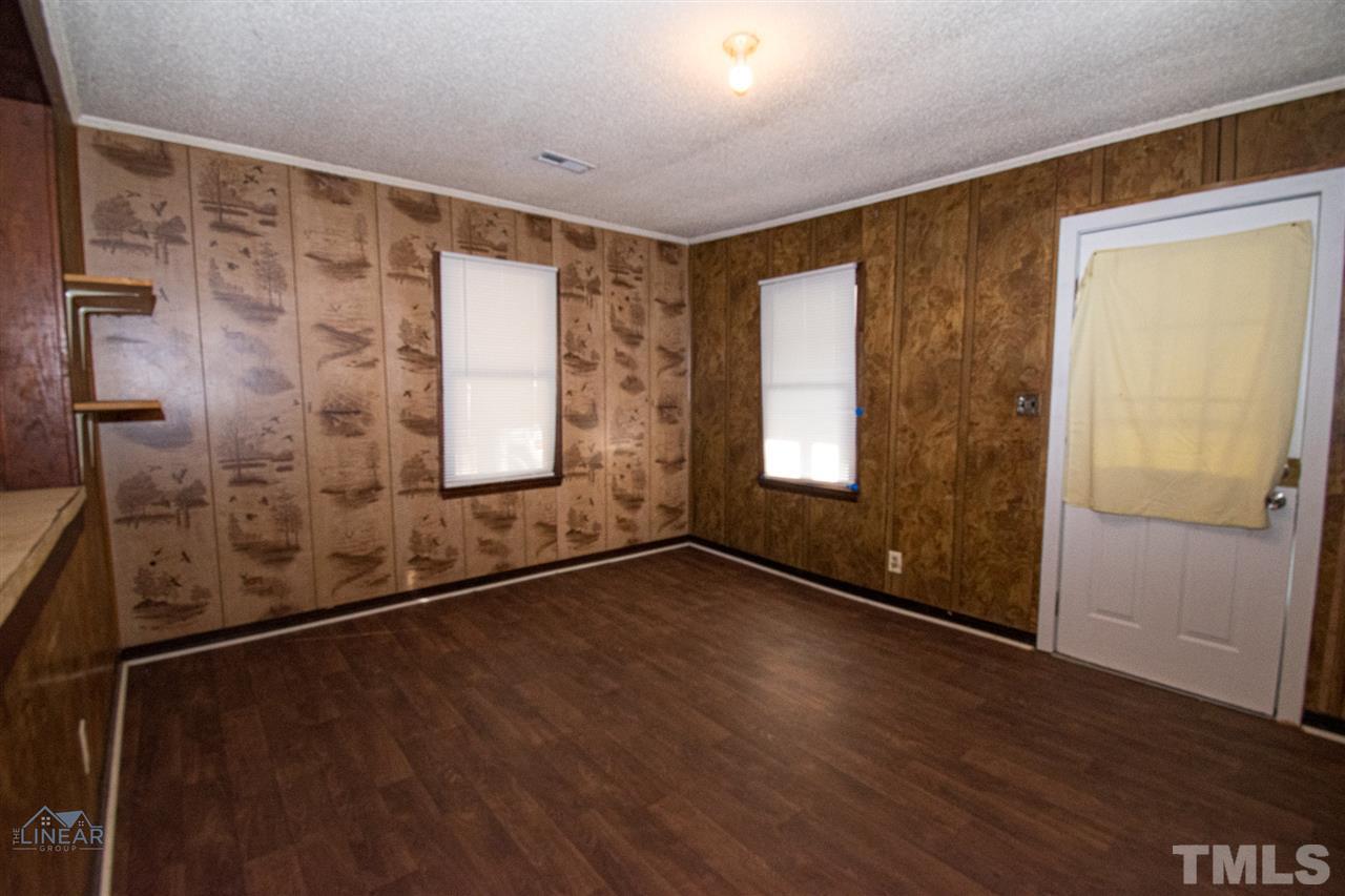 2243 Durham St Extension Burlington, NC 27217 - Photo 18 of 21 a view of an empty room with glass door
