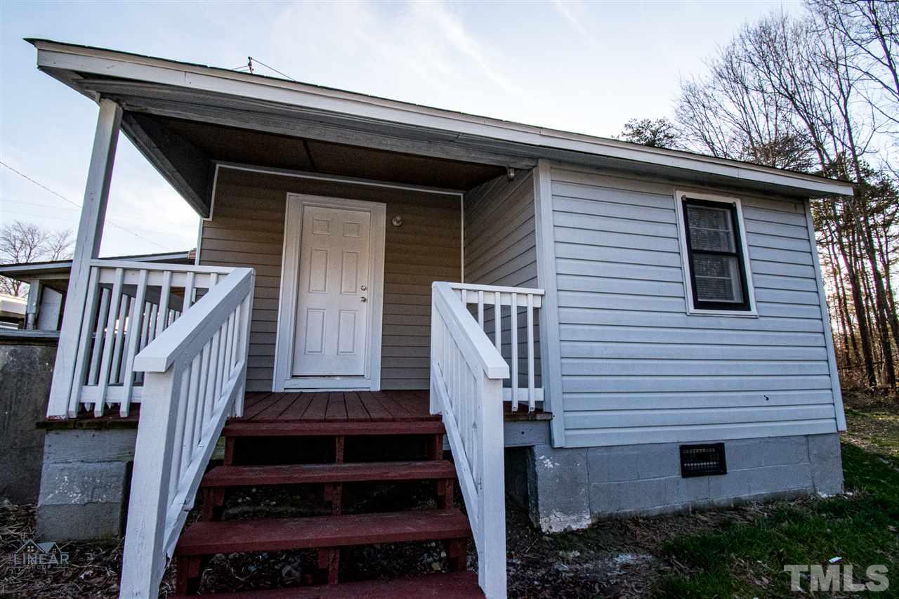 2243 Durham St Extension Burlington, NC 27217 - Photo 20 of 21 a front view of a house with wooden stairs