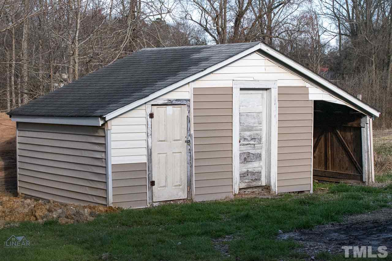 2243 Durham St Extension Burlington, NC 27217 - Photo 21 of 21 a view of a house with a yard