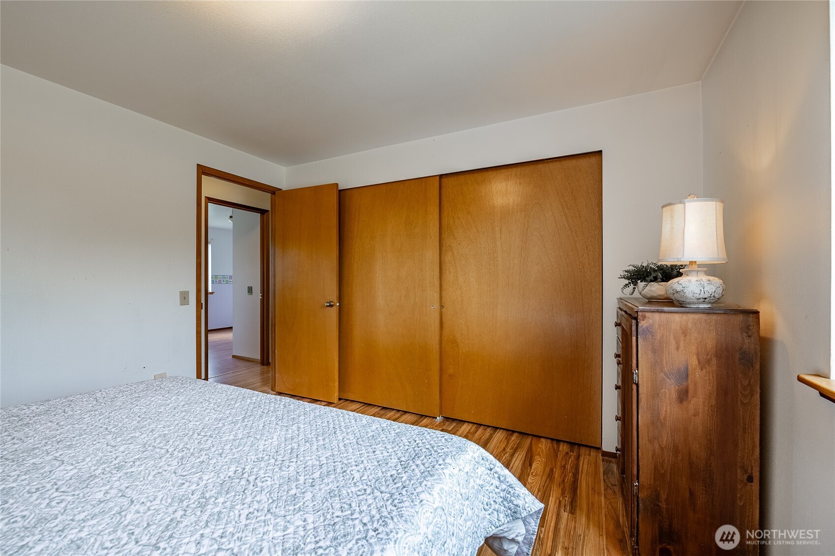 2136 Hawthorne Street Ferndale, WA 98248 - Photo 21 of 26 a bedroom with a bed and a lamp on table