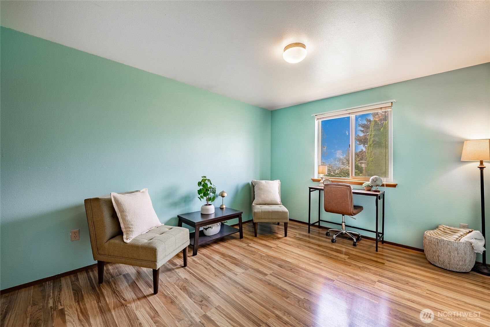 2136 Hawthorne Street Ferndale, WA 98248 - Photo 22 of 26 a living room with furniture and a wooden floor
