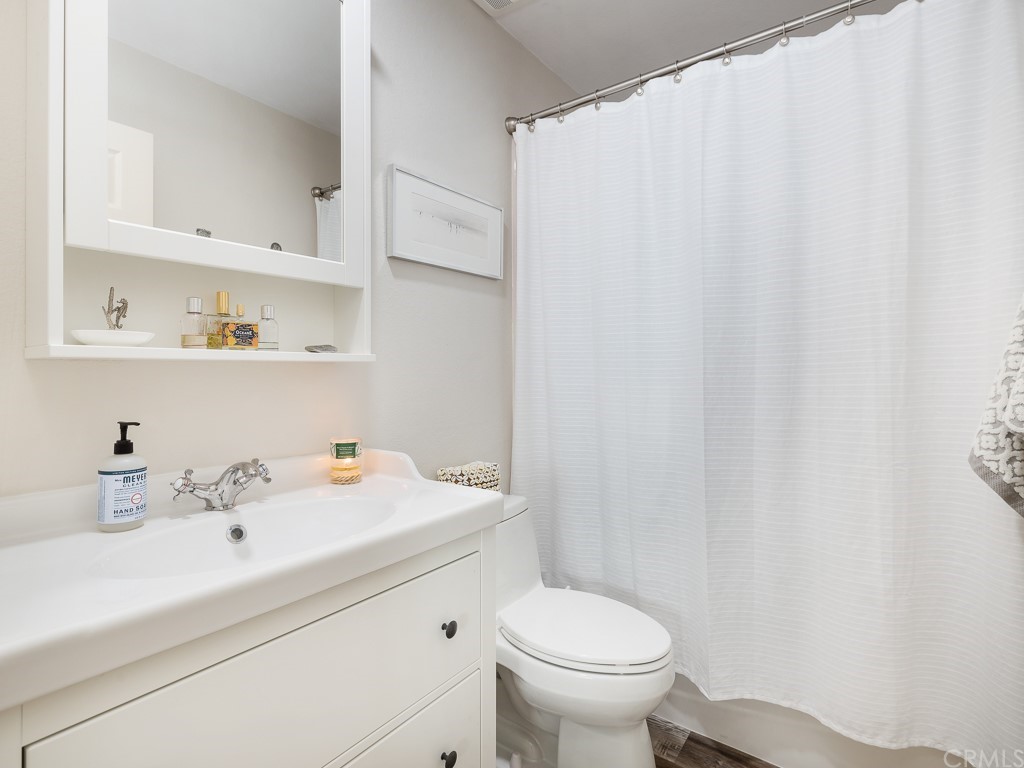 408 Richmond Street, Unit 10 El Segundo, CA 90245 - Photo 12 of 24 a bathroom with a sink a toilet and vanity