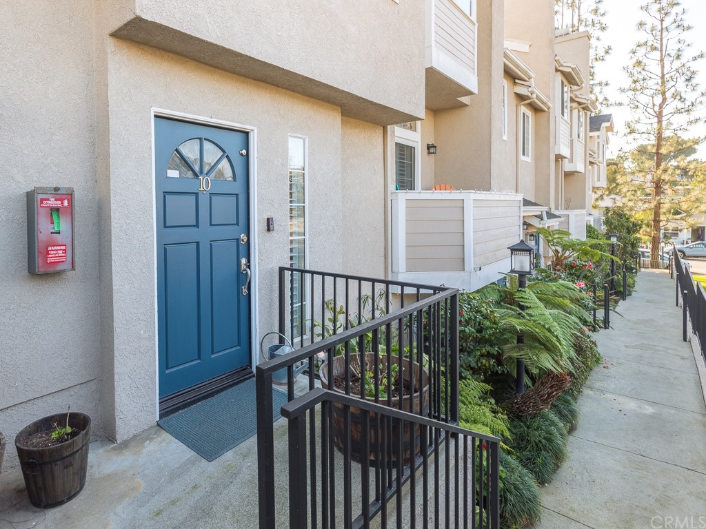 408 Richmond Street, Unit 10 El Segundo, CA 90245 - Photo 2 of 24 a view of a porch with potted plants