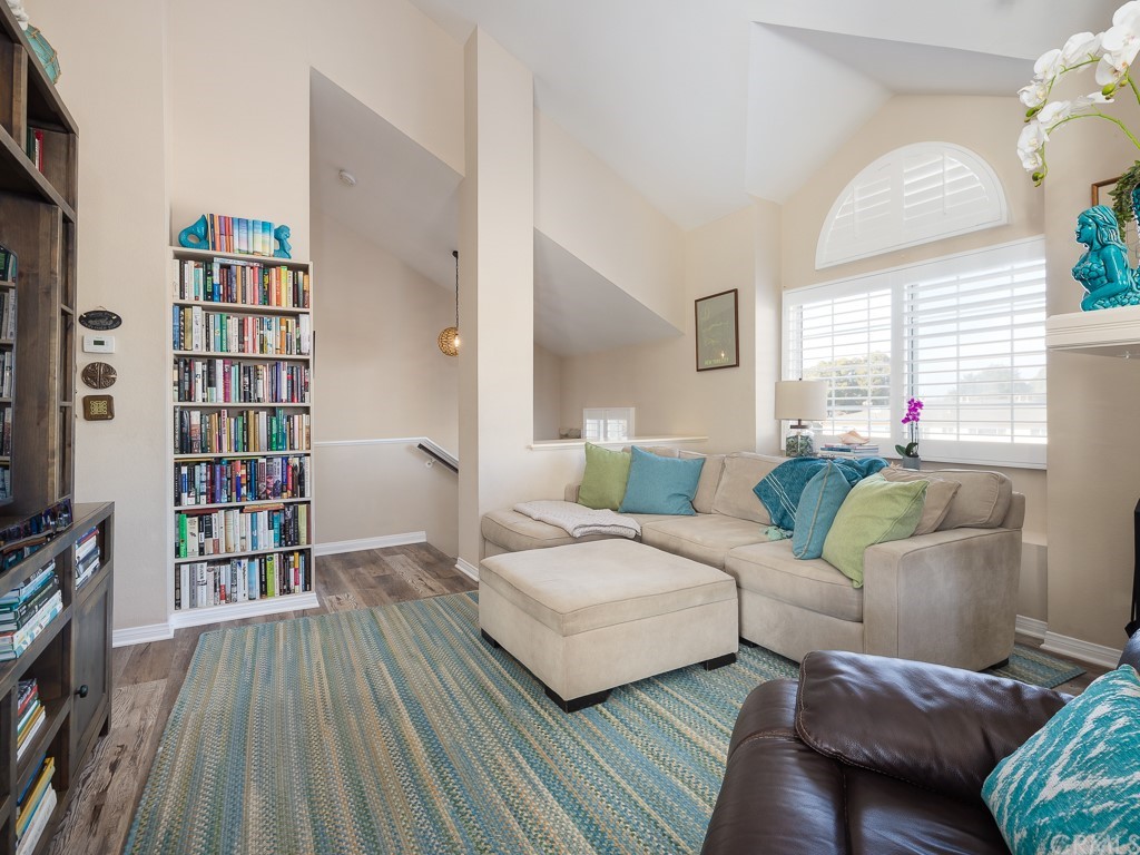 408 Richmond Street, Unit 10 El Segundo, CA 90245 - Photo 5 of 24 a living room with furniture and a book shelf