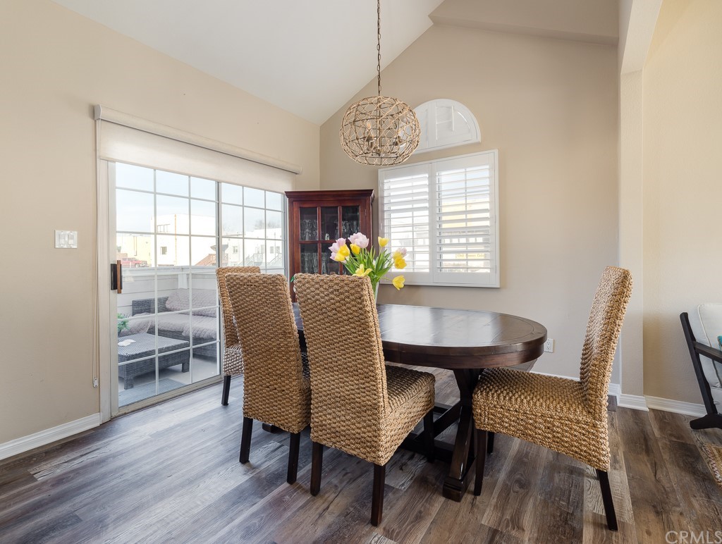 408 Richmond Street, Unit 10 El Segundo, CA 90245 - Photo 6 of 24 a view of a dining room with furniture window and wooden floor