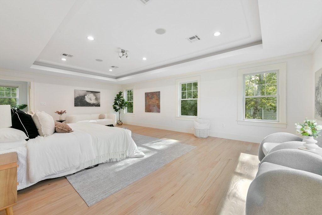 6 Norwich Road Wellesley, MA 02481 - Photo 15 of 34 a large bedroom with a large bed and a large window