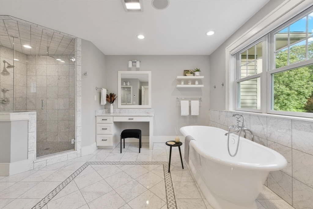 6 Norwich Road Wellesley, MA 02481 - Photo 16 of 34 a spacious bathroom with a tub a sink and a mirror