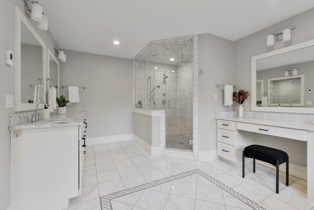 6 Norwich Road Wellesley, MA 02481 - Photo 17 of 34 a spacious bathroom with a granite countertop sink a mirror and a shower