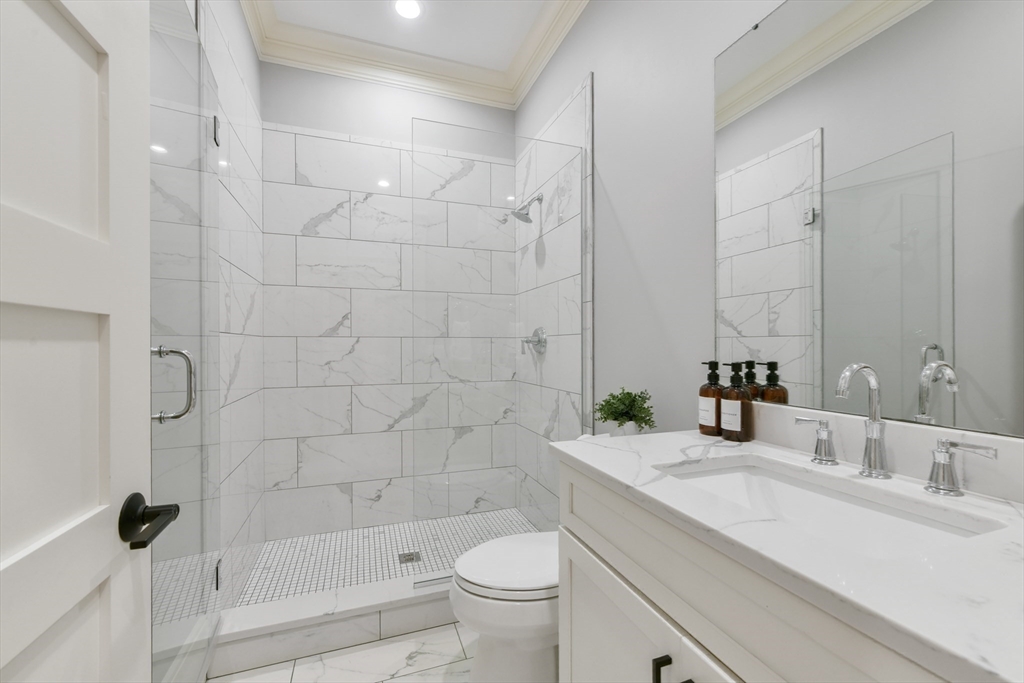 6 Norwich Road Wellesley, MA 02481 - Photo 20 of 34 a bathroom with a sink a toilet and shower