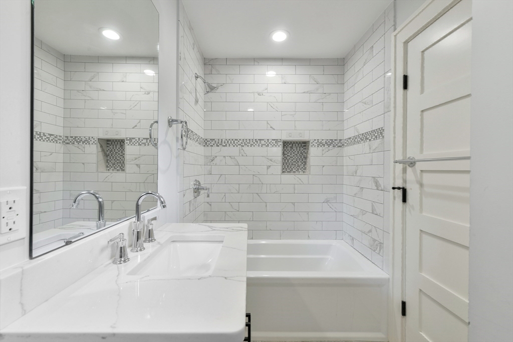 6 Norwich Road Wellesley, MA 02481 - Photo 22 of 34 a bathroom with a bathtub and a sink