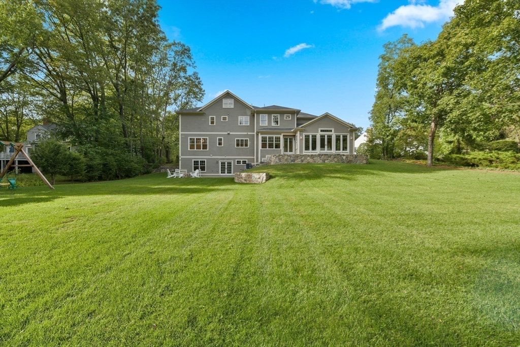 6 Norwich Road Wellesley, MA 02481 - Photo 31 of 34 a front view of a house with yard and green space
