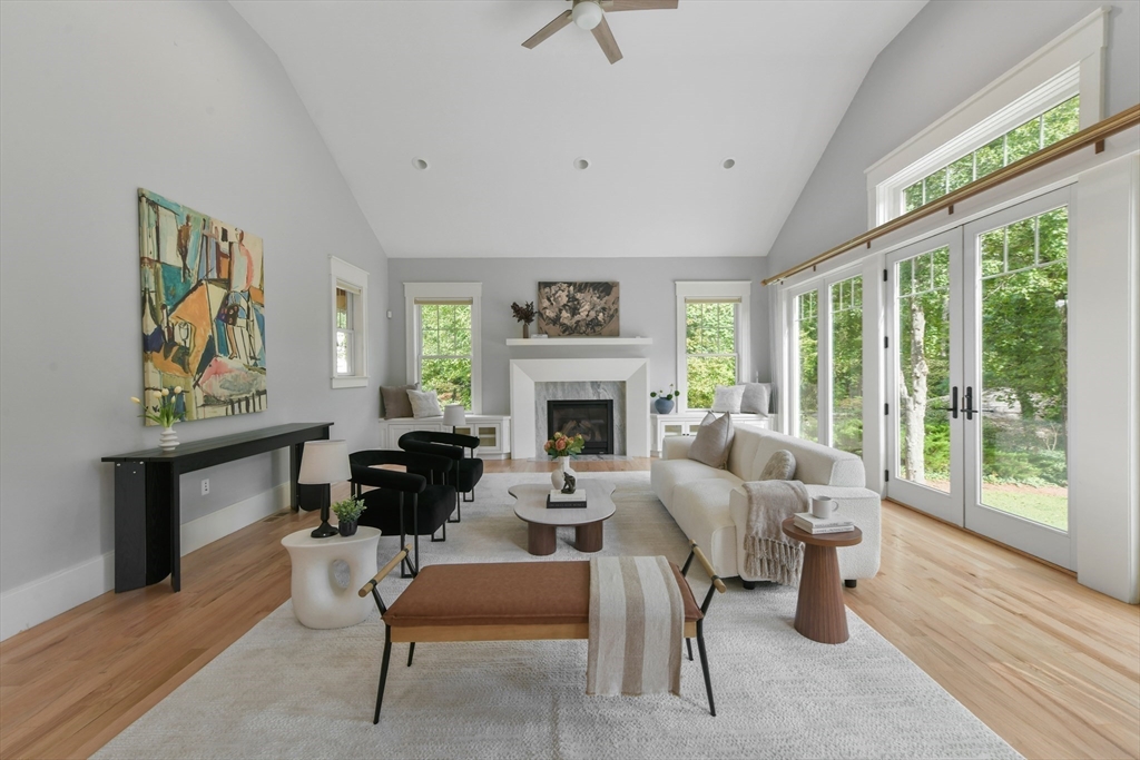 6 Norwich Road Wellesley, MA 02481 - Photo 10 of 34 a living room with furniture two windows and a fireplace