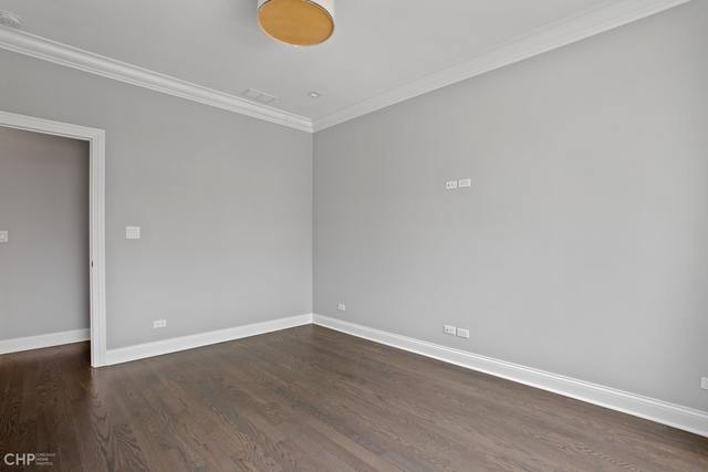211 South Hamilton Avenue, Unit 2 Chicago, IL 60612 - Photo 11 of 22 a view of an empty room with wooden floor