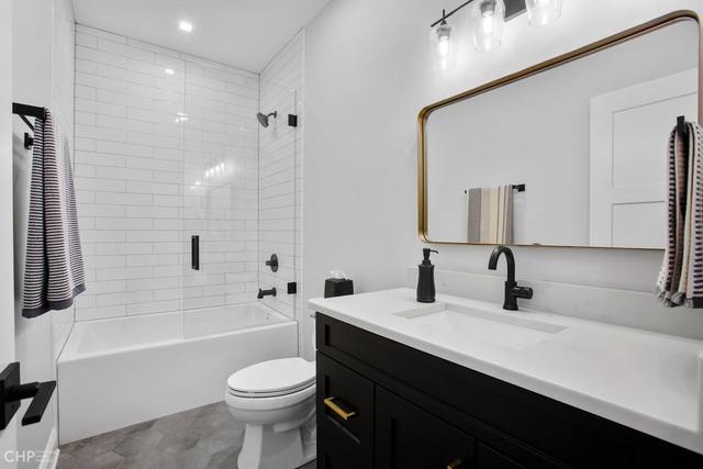 211 South Hamilton Avenue, Unit 2 Chicago, IL 60612 - Photo 17 of 22 a bathroom with a sink a toilet and shower