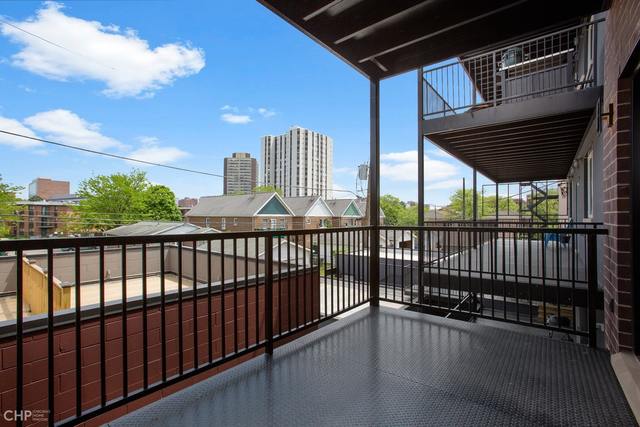 211 South Hamilton Avenue, Unit 2 Chicago, IL 60612 - Photo 20 of 22 a view of a balcony with wooden floor
