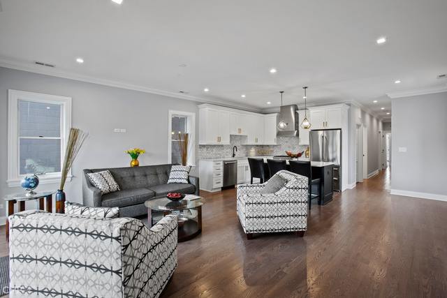 211 South Hamilton Avenue, Unit 2 Chicago, IL 60612 - Photo 3 of 22 a living room with furniture and kitchen view