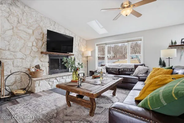 a living room with furniture and a flat screen tv