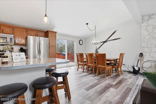 a dining room with furniture and window