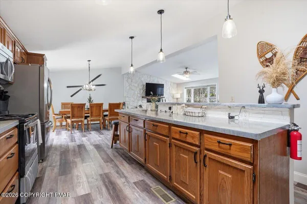 a very nice looking kitchen with a large window