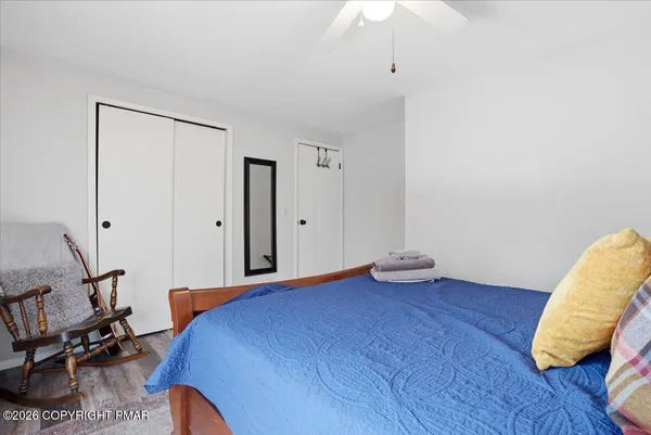 a bathroom with a sink vanity and a toilet