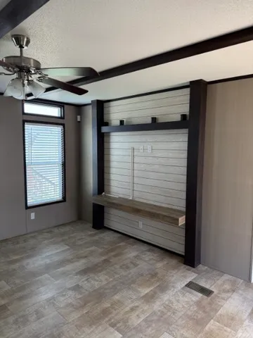 a view of a livingroom with furniture and chandelier