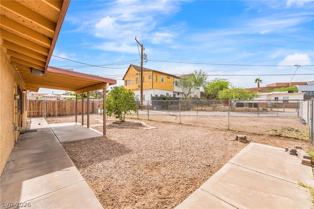242 Nebraska Avenue Henderson, NV 89015 - Photo 29 of 46 Fenced backyard with a patio and a residential view